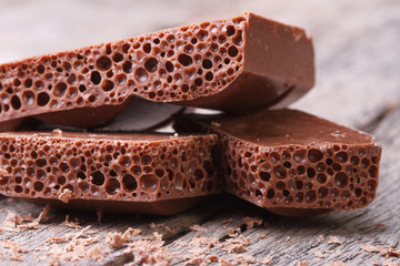porous chocolate and crumb on an old wooden table