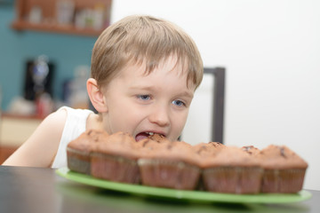 4 year old boy eats chocolate cake