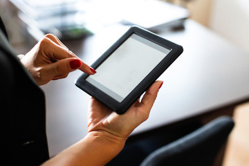 Woman holding a digital tablet