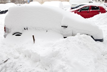 Fototapeta premium Car buried in snow