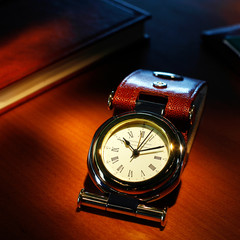 Men's luxury watch with leather strap and golden shine