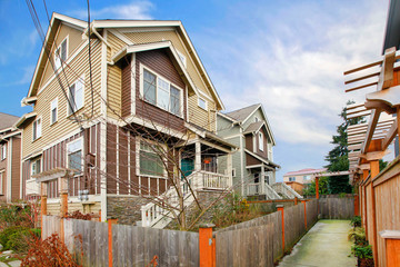Classic siding house with covered porch. Walkway