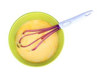 Corolla and broken eggs in bowl isolated on white