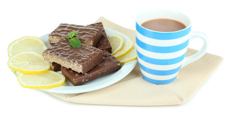 Cup of tea and sweets isolated on white