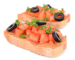 Delicious bruschetta with tomatoes isolated on white