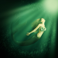 Fantasy beautiful woman mermaid with tail