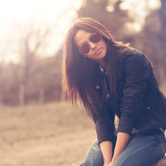 Young beautiful woman in sunglasses at sunny day