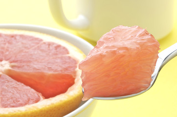 Bite Of Grapefruit On Spoon