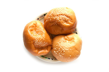 delicious bun with sesame seeds isolated on white