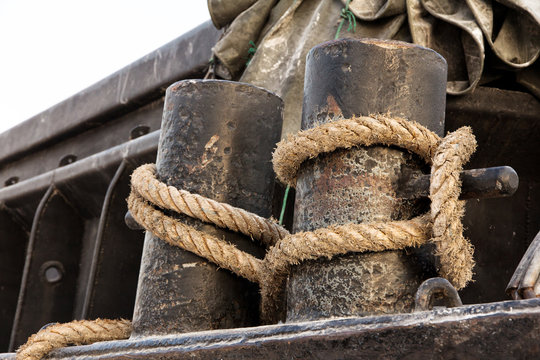 fairleads with ropes,Ropes at a commercial ship in port