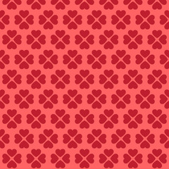 Seamless pink heart pattern on red background.