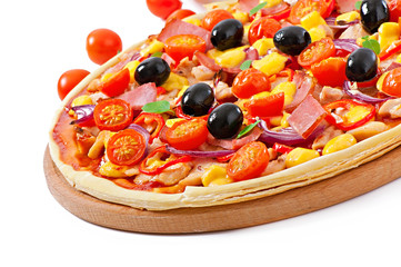 Pizza with vegetables, chicken, ham and olives isolated on white