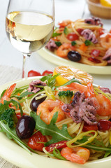 Seafood spaghetti pasta dish with octopus and shrimps