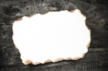 burned paper on wooden texture - 60939578