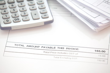 Business document of tax invoice form with calculator