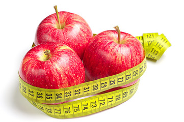 Red apples and measuring tape