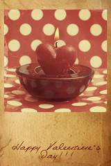 burning candle heart  on wooden background