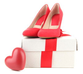 Beautiful red female shoes, heart and gift box, isolated