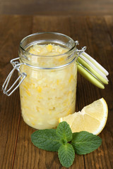 Tasty lemon jam on table close-up