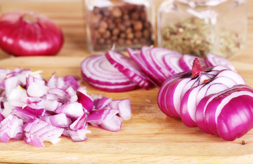 Cut onion on cutting board on wooden background