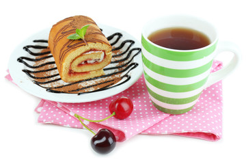 Cup of tea and sweets isolated on white