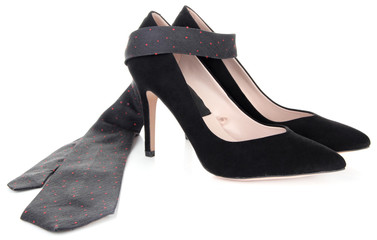 Beautiful black female shoes and tie, isolated on white