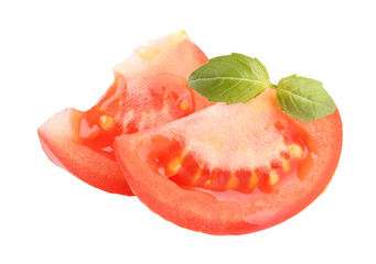 Slices of fresh tomato with basil, isolated on white