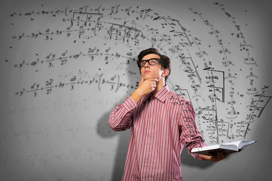 young scientist holding a book