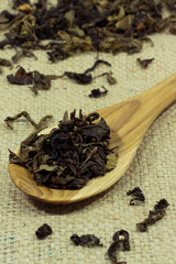 Spoon of dried tea leaves