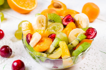 Fototapeta na wymiar Salad of fruits and berries