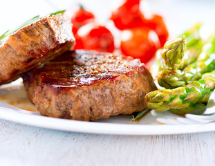 Steaks. Grilled Beef Steak Meat with Vegetables