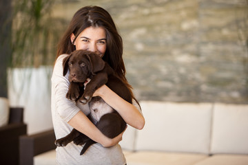 Gorgeous young woman and her puppy