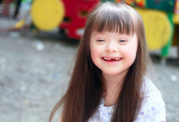 Portrait of beautiful young girl on the playground.