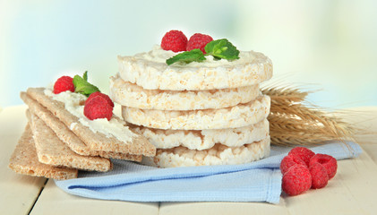 Tasty crispbread with berries, on white table