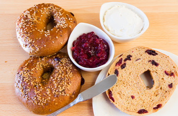 Homemade whole grain bagels with sesame seeds and cranberries.
