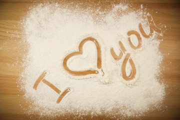 Flour on the table with text I LOVE YOU