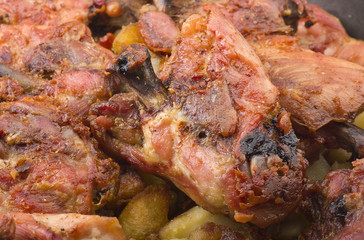 Obraz na płótnie Canvas roasted chicken drumsticks with potatoes and spices