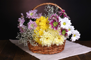Beautiful chrysanthemum flowers in wicker basket