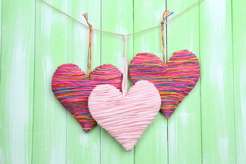 Decorative hearts on wooden background
