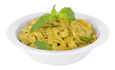 Delicious pasta with pesto on plate isolated on white