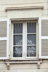 Fototapeta na wymiar White window with shutters