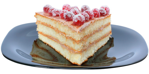 Layered piece of cake on a black plate.