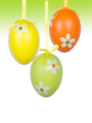 Group of hanging Easter eggs on a white background