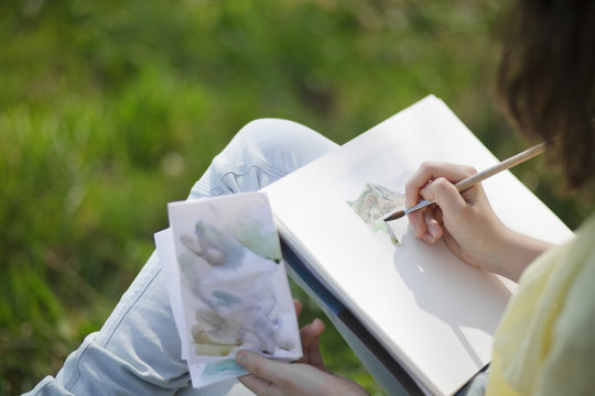 Teen Artist Painting With Watercolour Paint Outdoor.