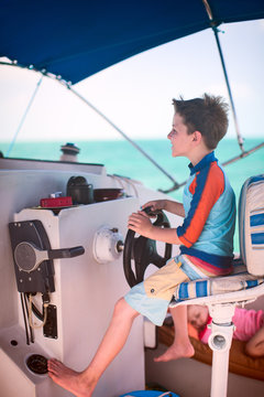 Boy drives catamaran