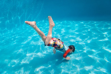 Boy swimming underwater
