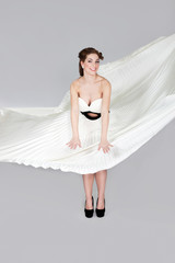 Romantic blonde beauty wearing white dress