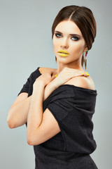 Fototapeta premium Portrait of young model fashion beauty posing in studio.