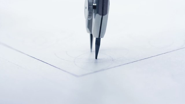 Drawing compasses.