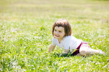 Fototapeta premium three year old child at grass meadow